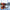 Lunettes de soleil sportives UV400 monture noire avec verres orange rouge effet miroir.