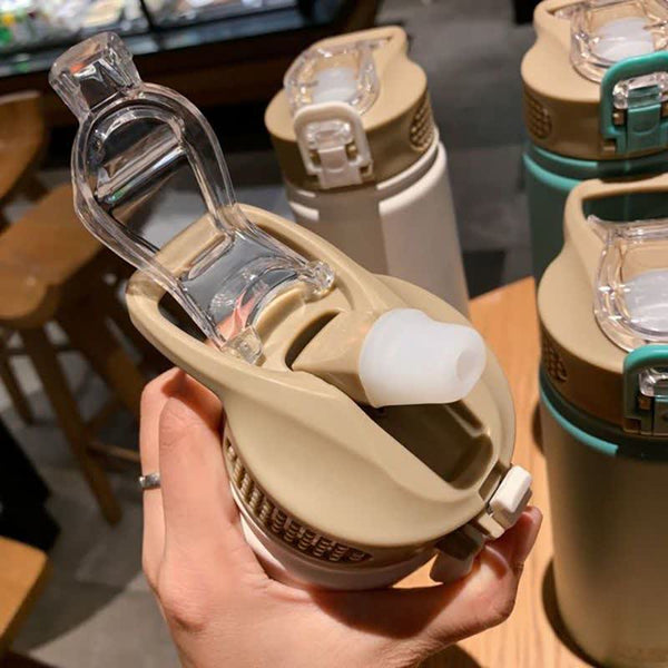 Bouteille isotherme avec embout en silicone et paille, bouchon transparent