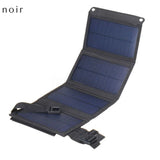 Panneau solaire pliable noir déplié montrant les cellules solaires