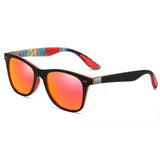 Lunettes de soleil polarisées noires avec intérieur coloré et verres miroir rouges