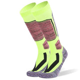 Chaussettes thermiques fluo et noires, renforts aux zones clés pour le confort