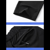 Détails de la poche zippée et de la ceinture élastique d'un pantalon noir d'été grande taille pour homme