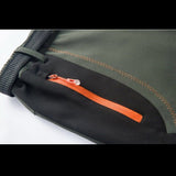 Fermeture éclair et poche latérale du pantalon de randonnée femme, design fonctionnel avec tirette orange.