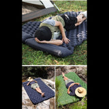 Matelas gonflable double bleu marine pour camping avec oreiller intégré, utilisé dans une tente en plein air