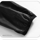 Manchette rétractable de la veste imperméable noire, offrant une meilleure protection contre le vent