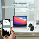 Notification de rappel sur téléphone, indiquant la perte de l'étiquette, avec un ordinateur portable à côté