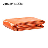Couverture de survie orange de 210cm x 130cm, pliée