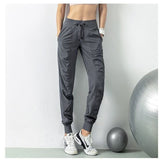 Pantalon de sport gris pour femme, idéal pour les exercices en salle de sport, avec cordon de serrage