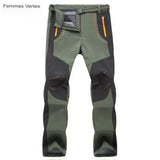 Pantalon de randonnée femme vert avec poches zippées et couture renforcée